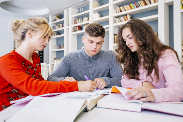 students-studying-together-library