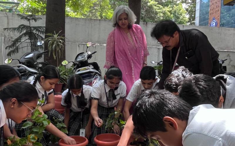 NHPS students planting saplings to honour teachers on Guru Purnima