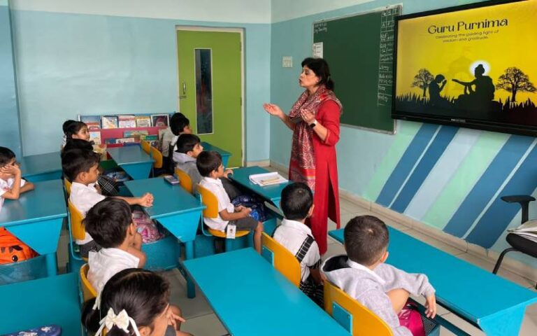 Teacher narrating Guru Purnima story to Pre-Primary students at NHPS