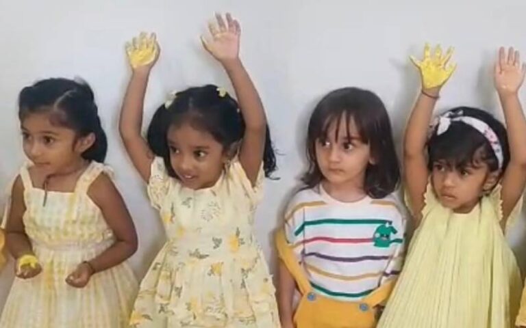 color day c-children-raising hands with color